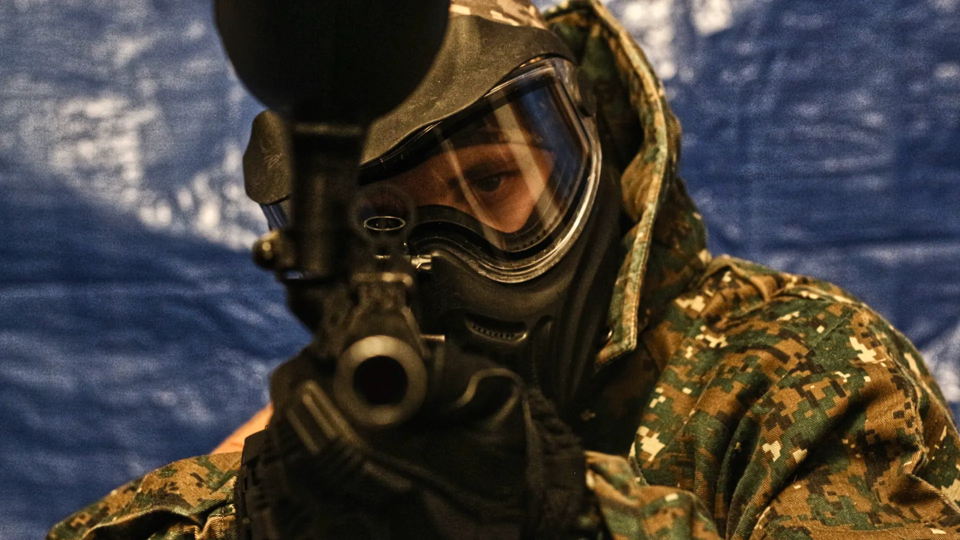 Reball player wearing a protective mask and holding a marker